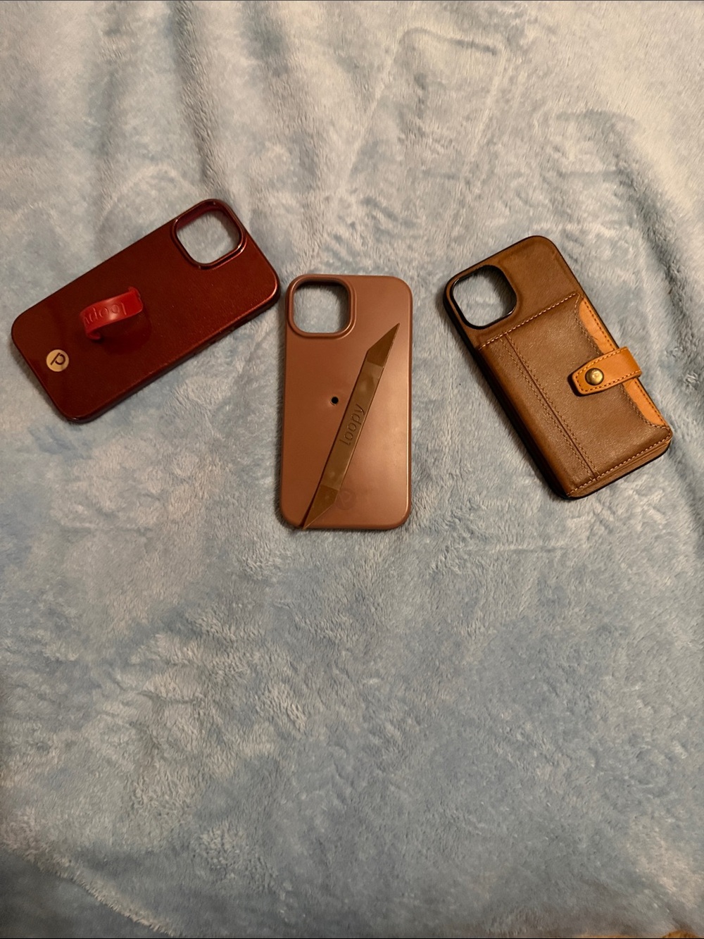 iPhone 15 2 Loopy Cases and one Brown Wallet Case with Card Slot